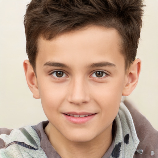 Joyful white child male with short  brown hair and brown eyes