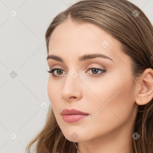 Neutral white young-adult female with long  brown hair and brown eyes