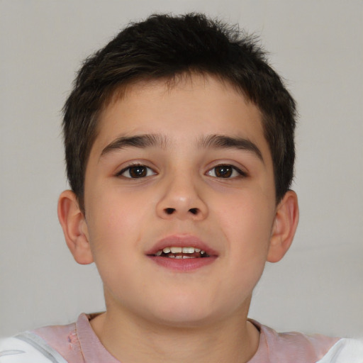 Joyful white child male with short  brown hair and brown eyes