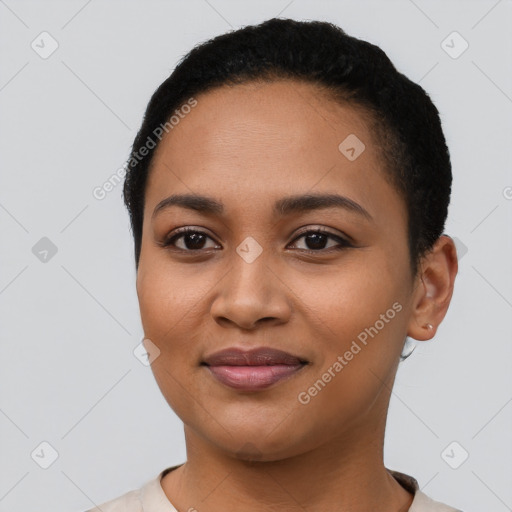 Joyful latino young-adult female with short  black hair and brown eyes