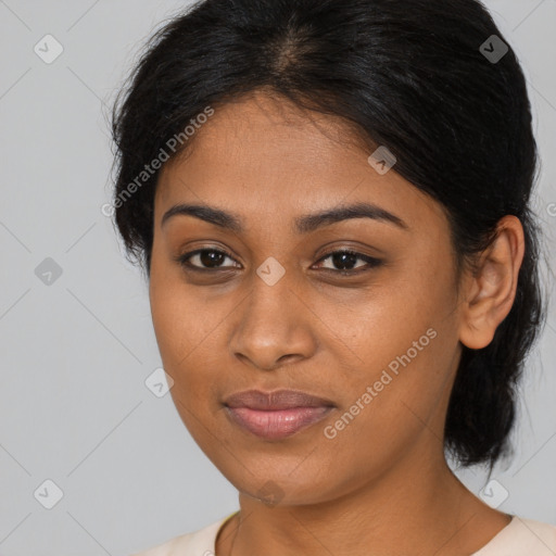 Joyful black young-adult female with medium  brown hair and brown eyes