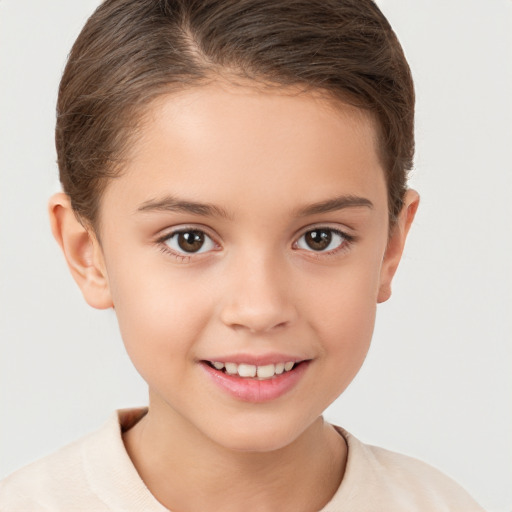 Joyful white child female with short  brown hair and brown eyes