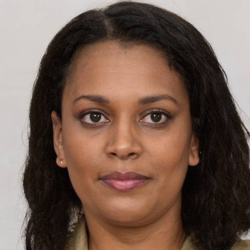 Neutral black young-adult female with long  brown hair and brown eyes
