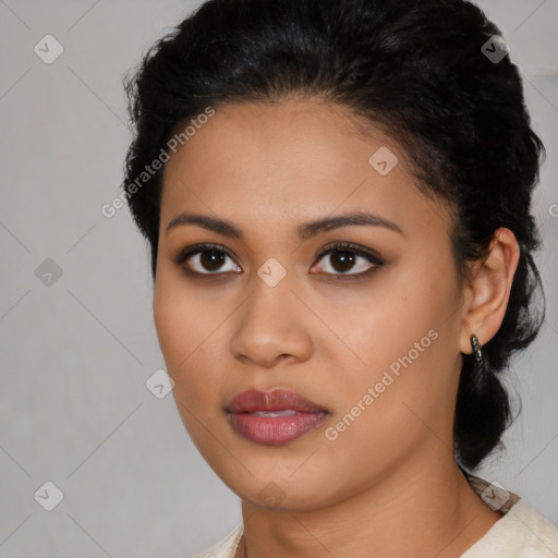 Joyful latino young-adult female with short  black hair and brown eyes