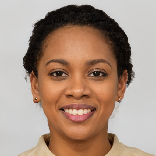 Joyful latino young-adult female with short  brown hair and brown eyes