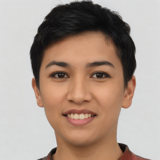 Joyful asian young-adult female with short  black hair and brown eyes