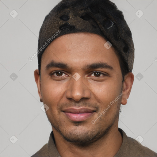 Joyful black young-adult male with short  black hair and brown eyes