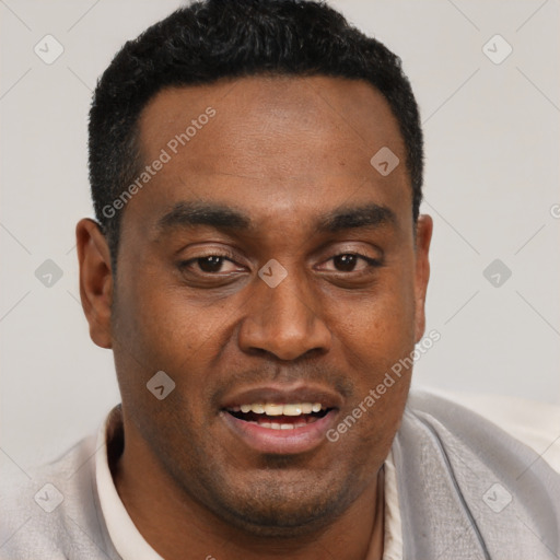 Joyful black young-adult male with short  black hair and brown eyes
