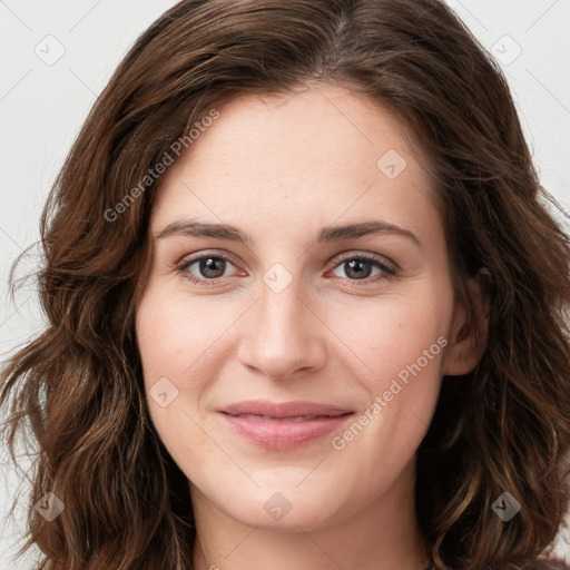 Joyful white young-adult female with long  brown hair and green eyes