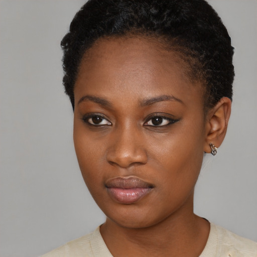 Neutral black young-adult female with short  black hair and brown eyes