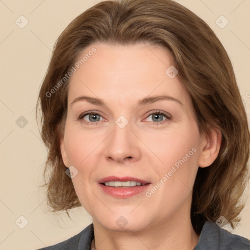 Joyful white adult female with medium  brown hair and grey eyes