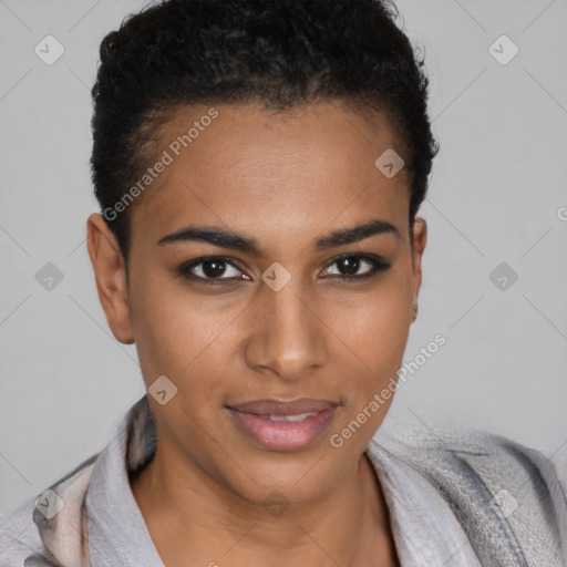 Joyful black young-adult female with short  brown hair and brown eyes