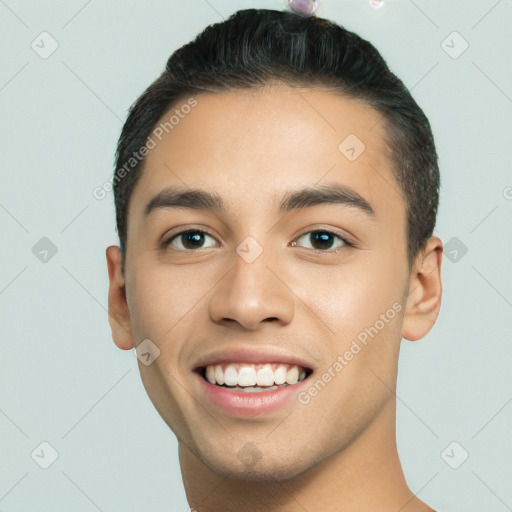 Joyful white young-adult male with short  black hair and brown eyes