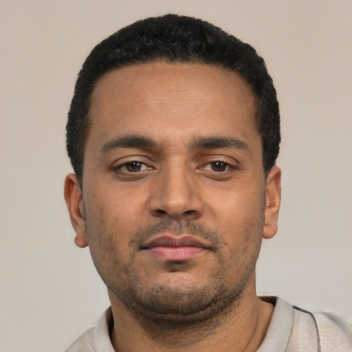 Neutral latino young-adult male with short  black hair and brown eyes