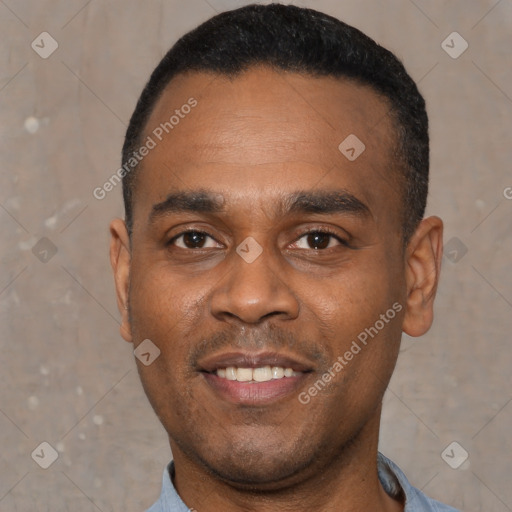 Joyful black young-adult male with short  black hair and brown eyes