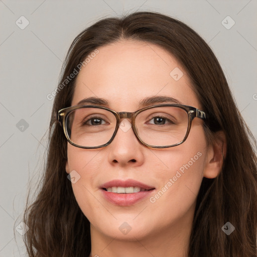 Joyful white young-adult female with long  brown hair and blue eyes