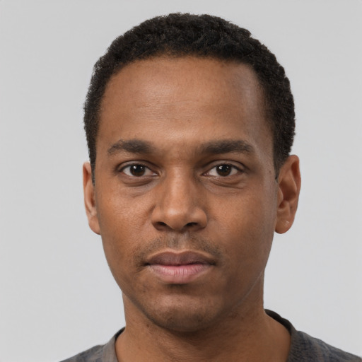 Neutral black young-adult male with short  black hair and brown eyes