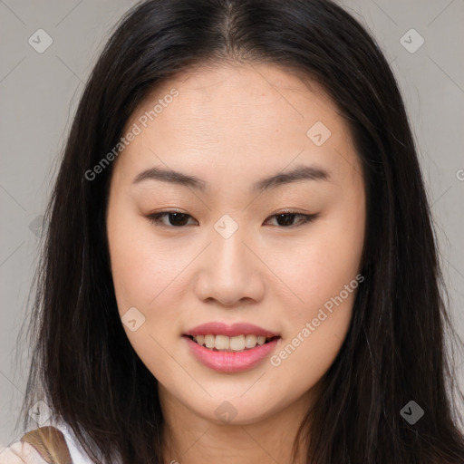 Joyful asian young-adult female with long  brown hair and brown eyes