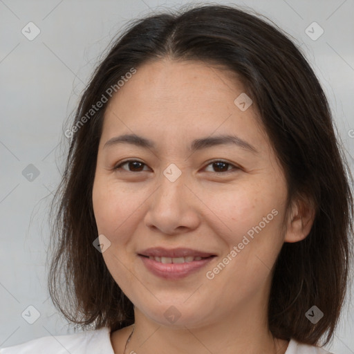 Joyful white adult female with medium  brown hair and brown eyes