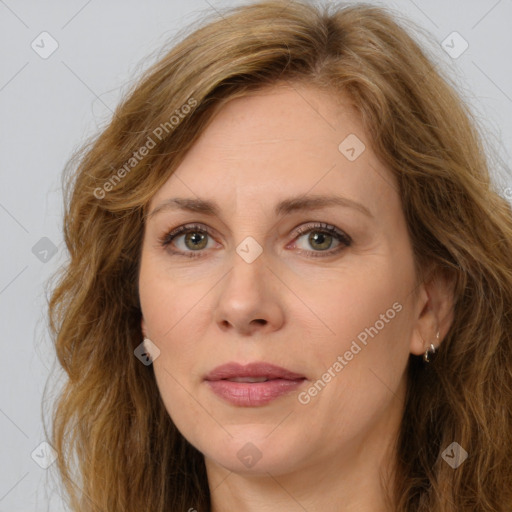 Joyful white adult female with long  brown hair and brown eyes