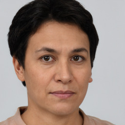 Joyful white adult female with short  brown hair and brown eyes