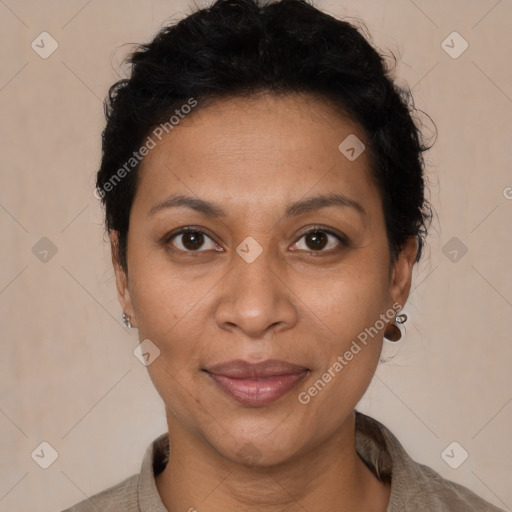 Joyful latino adult female with short  brown hair and brown eyes