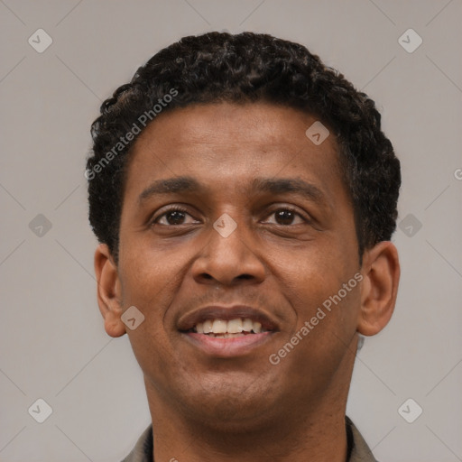 Joyful latino young-adult male with short  brown hair and brown eyes
