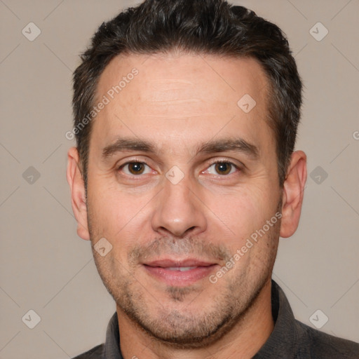 Joyful white adult male with short  brown hair and brown eyes