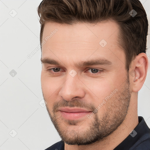 Joyful white young-adult male with short  brown hair and brown eyes