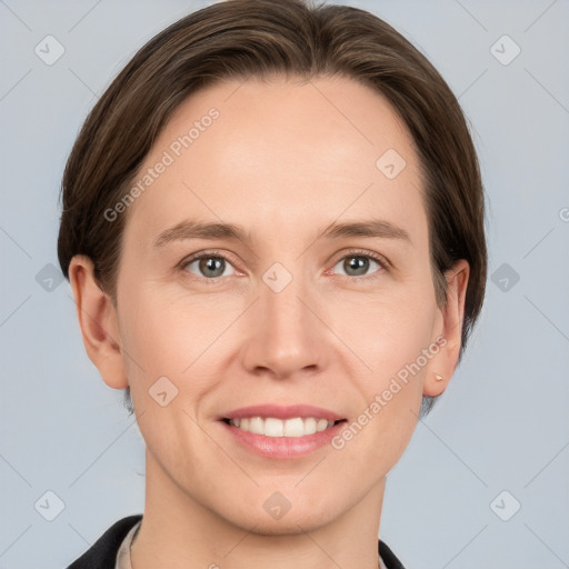 Joyful white young-adult female with medium  brown hair and grey eyes