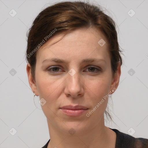 Joyful white adult female with short  brown hair and grey eyes