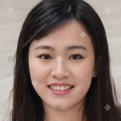 Joyful asian young-adult female with long  brown hair and brown eyes