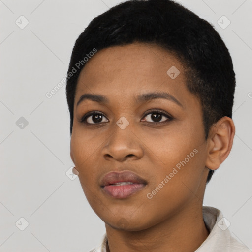 Joyful black young-adult female with short  black hair and brown eyes