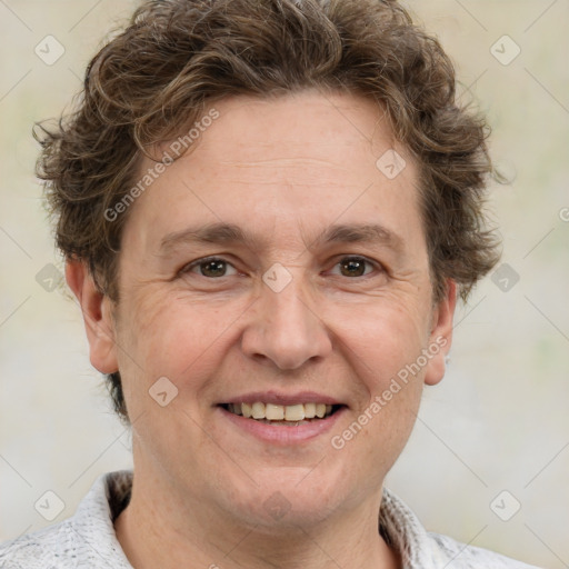 Joyful white adult male with short  brown hair and grey eyes