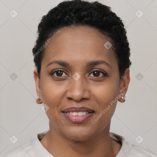 Joyful black young-adult female with short  black hair and brown eyes