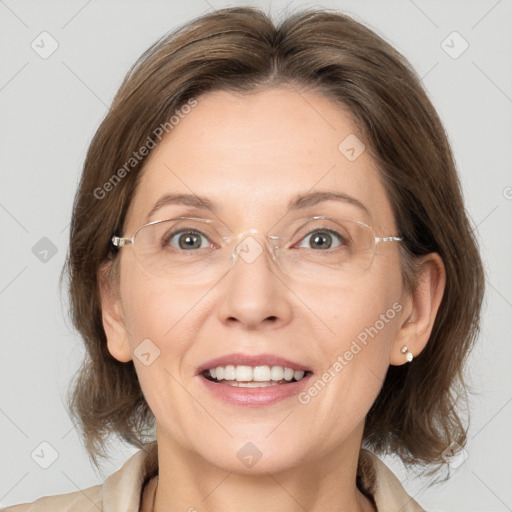 Joyful white adult female with medium  brown hair and grey eyes