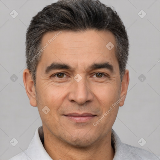 Joyful white adult male with short  brown hair and brown eyes