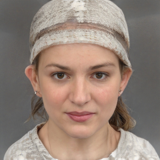 Joyful white young-adult female with medium  brown hair and grey eyes