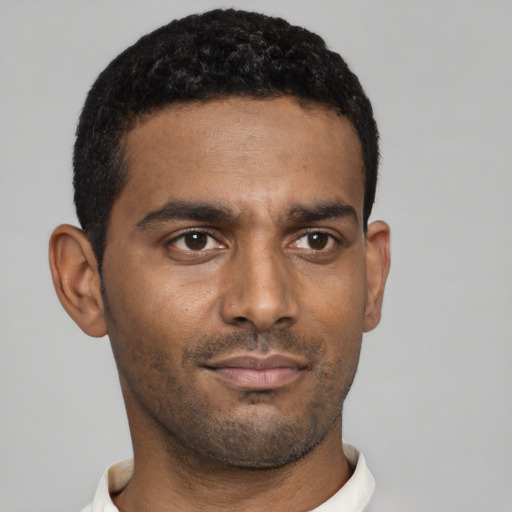 Neutral black young-adult male with short  black hair and brown eyes