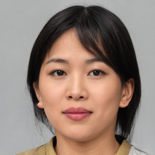 Neutral asian young-adult female with medium  brown hair and brown eyes