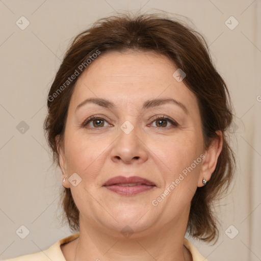 Joyful white adult female with medium  brown hair and brown eyes