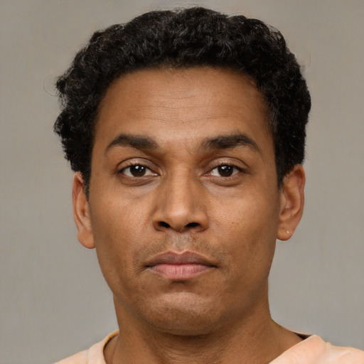 Neutral latino adult male with short  black hair and brown eyes