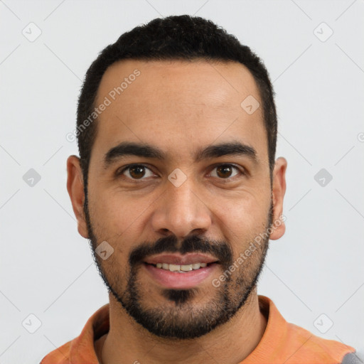 Joyful latino young-adult male with short  black hair and brown eyes