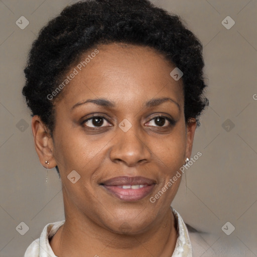 Joyful black adult female with short  brown hair and brown eyes