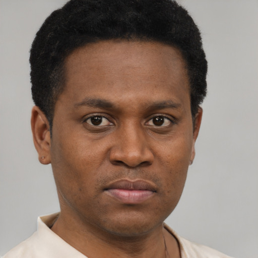 Neutral black young-adult male with short  black hair and brown eyes