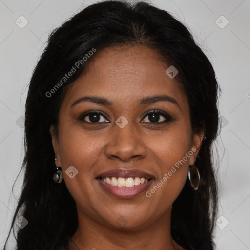 Joyful black young-adult female with long  brown hair and brown eyes