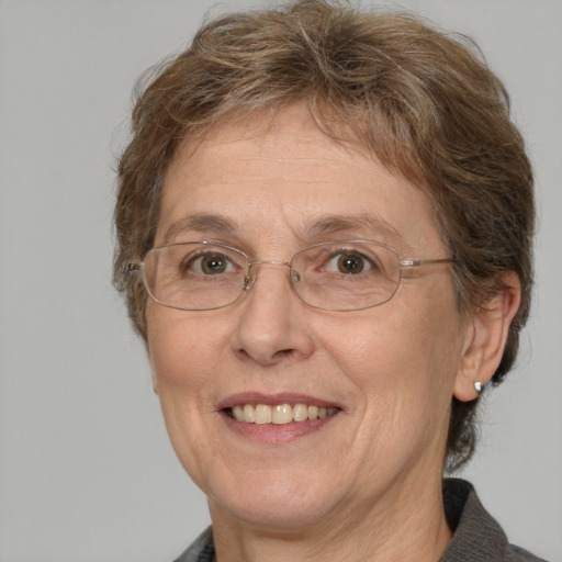 Joyful white middle-aged female with medium  brown hair and brown eyes