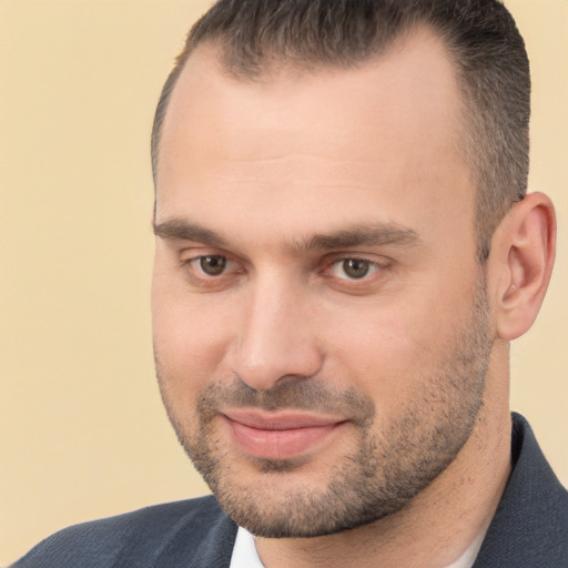 Joyful white adult male with short  brown hair and brown eyes