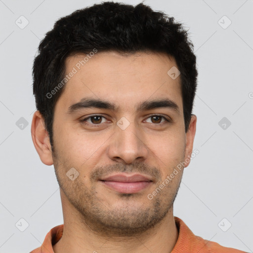 Joyful latino young-adult male with short  brown hair and brown eyes