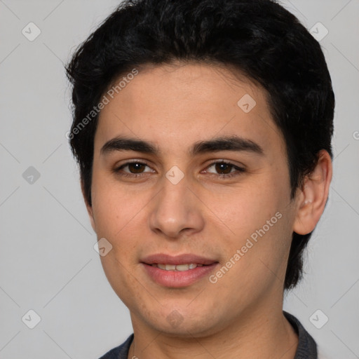 Joyful latino young-adult male with short  brown hair and brown eyes